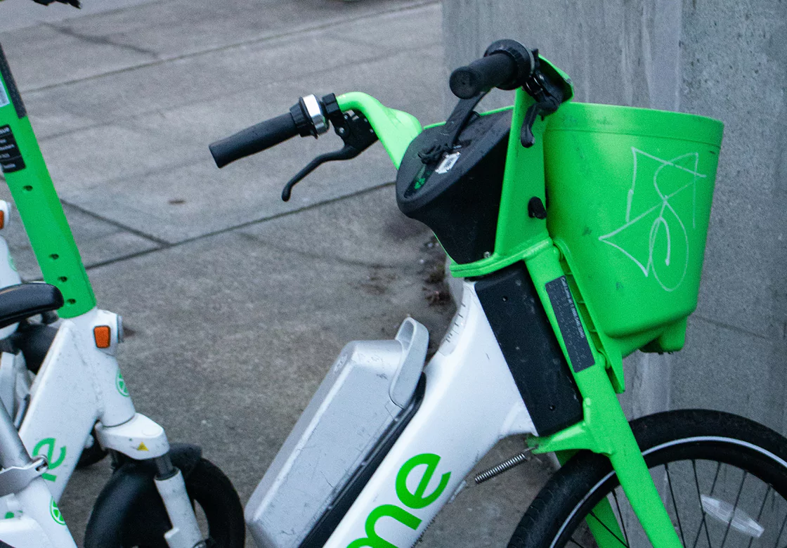 A green bicycle with a front basket