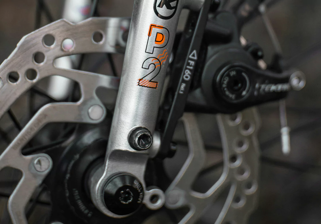 Close-up of a bicycle brake disc, showcasing its metallic surface