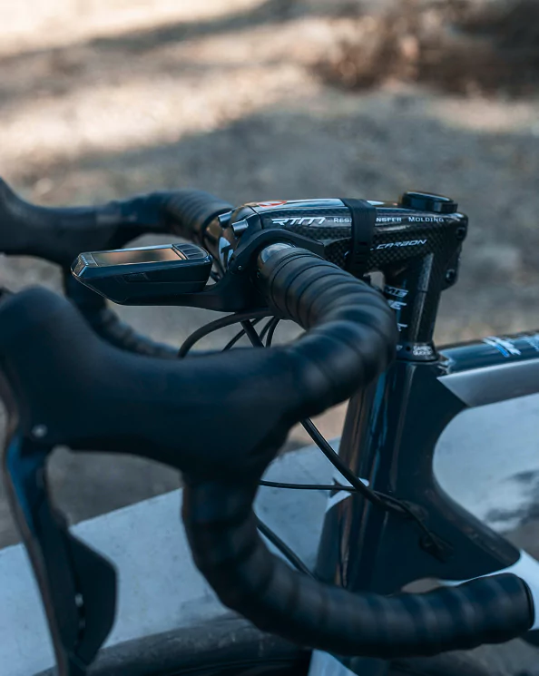 Close-up of a bike handlebar featuring a sleek black grip
