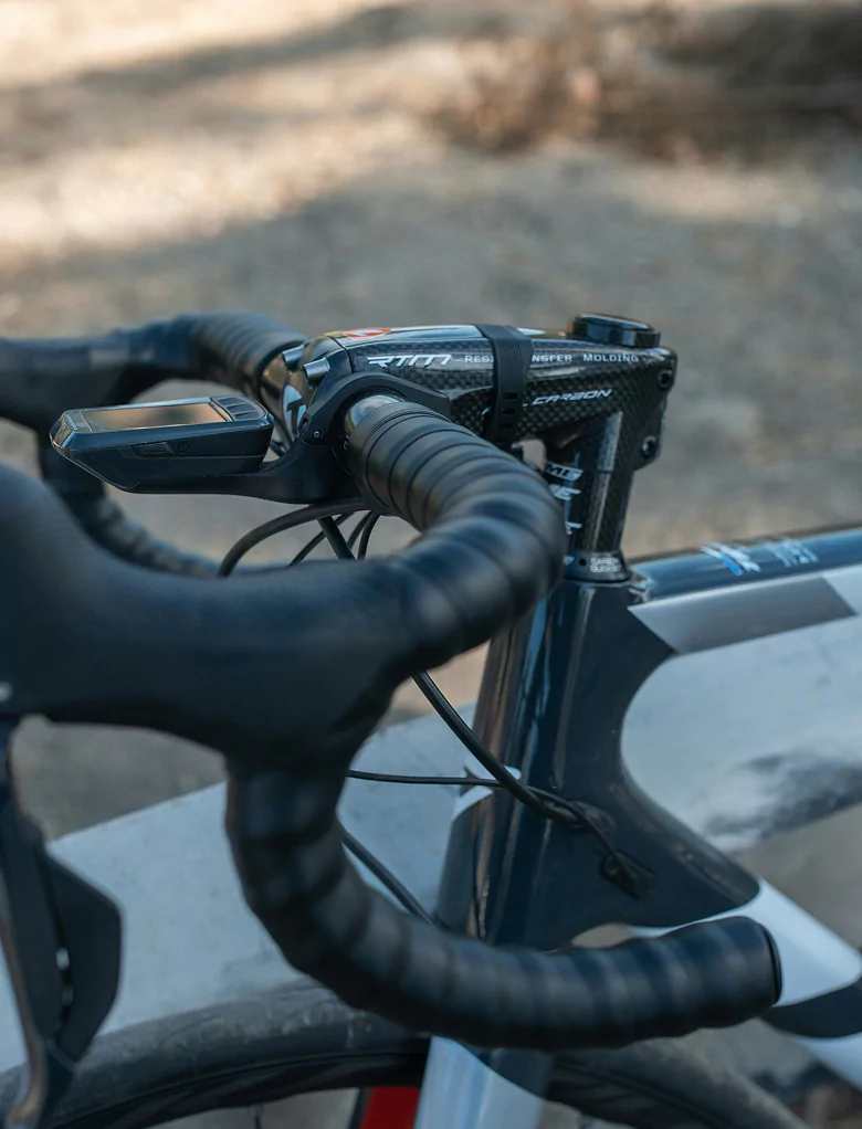 Close-up of a bike handlebar featuring a sleek black grip