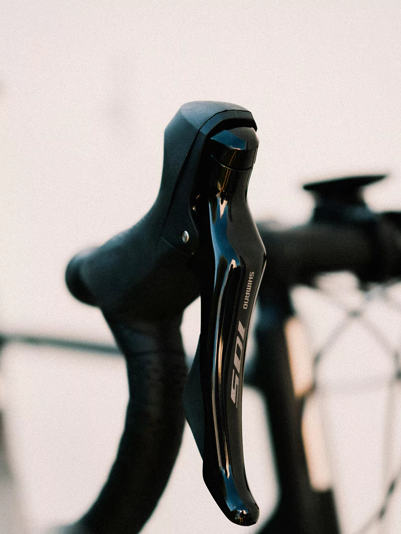 Close-up of a black bike handle, showcasing its texture